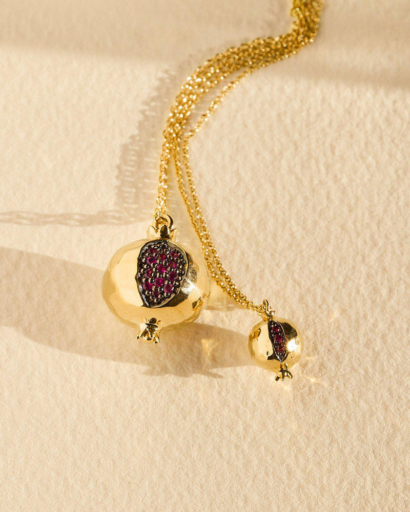 gold pomegranate pendant with ruby seeds