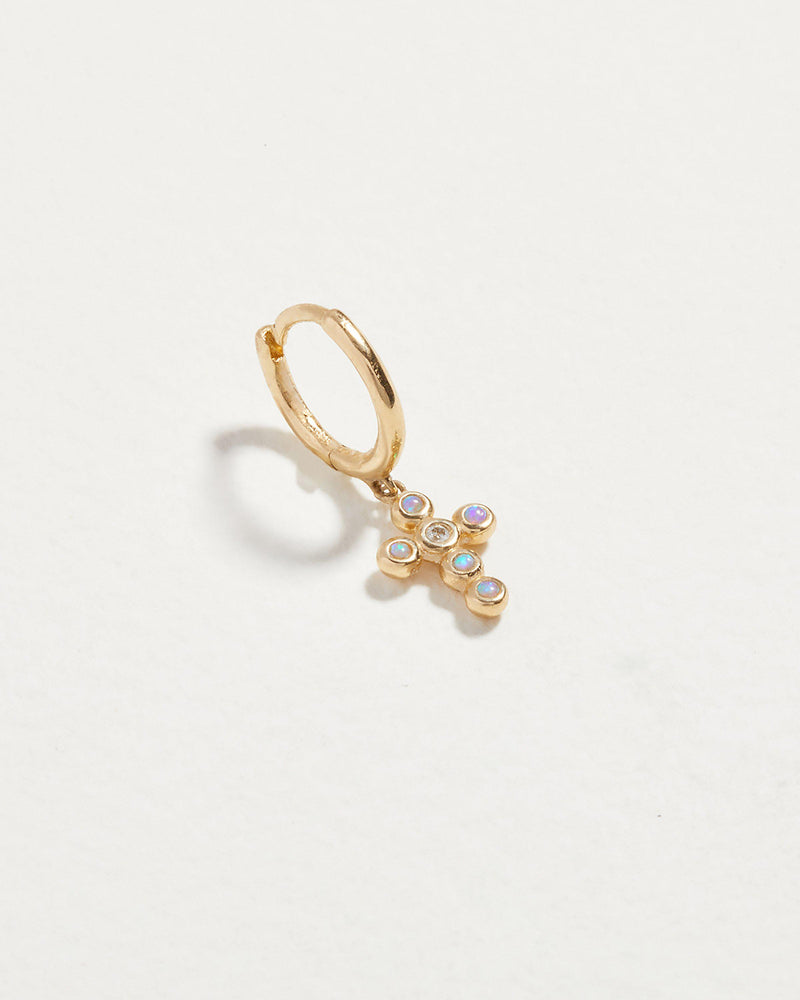cross cluster huggie piercing with opal and diamonds