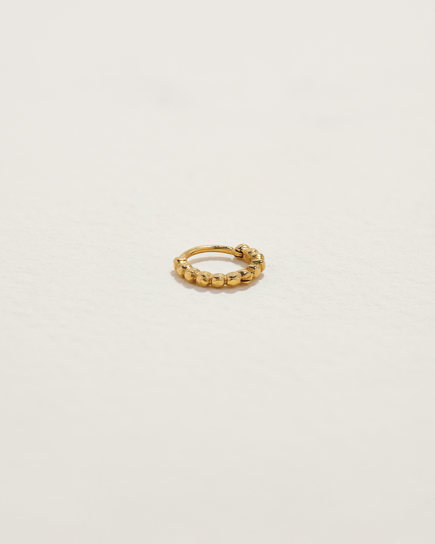 gold infinity huggie earring