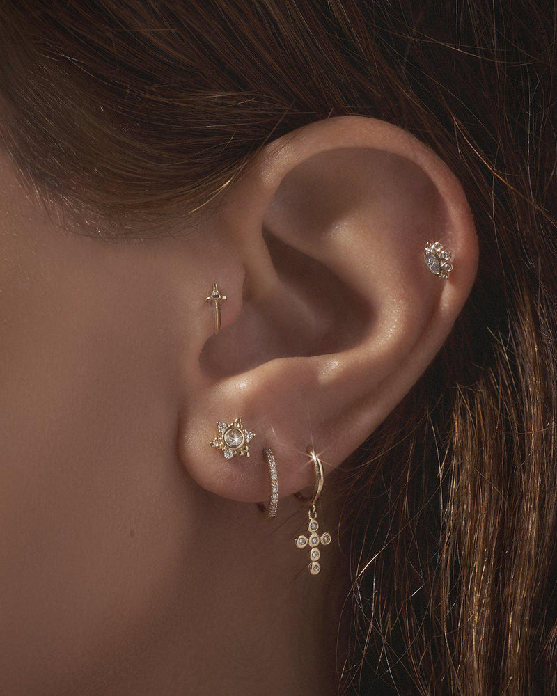 diamond ear piercings on the model