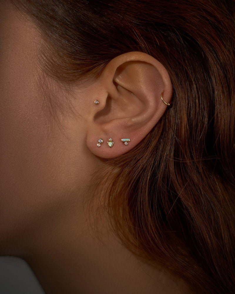 triangle dot stud earring with diamond on the model