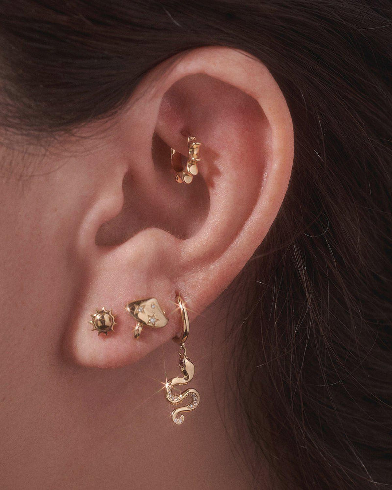 gold snake huggie earring on the model