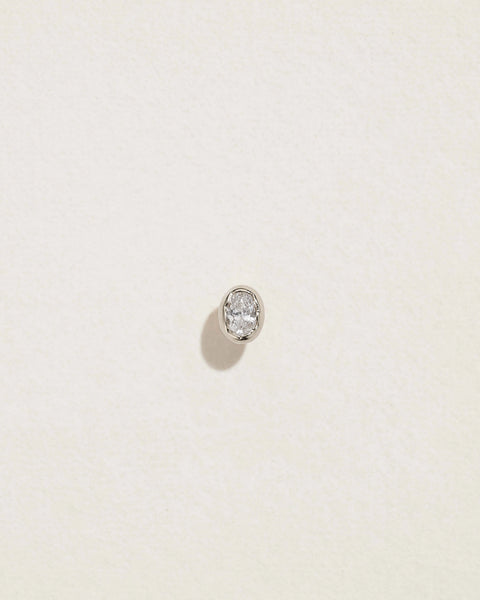Front view of Nugget Stud featuring an oval faceted stone in a rounded bezel