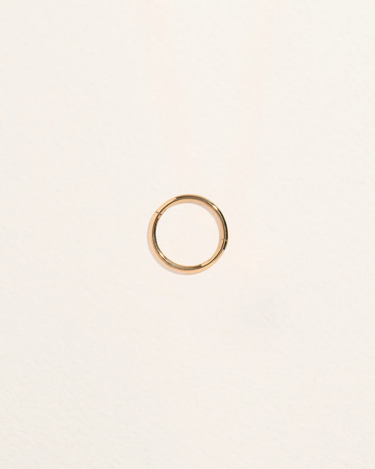 14K yellow gold seamless clicker hoop with hinge clicker closure, 10mm inside diameter, shown from above