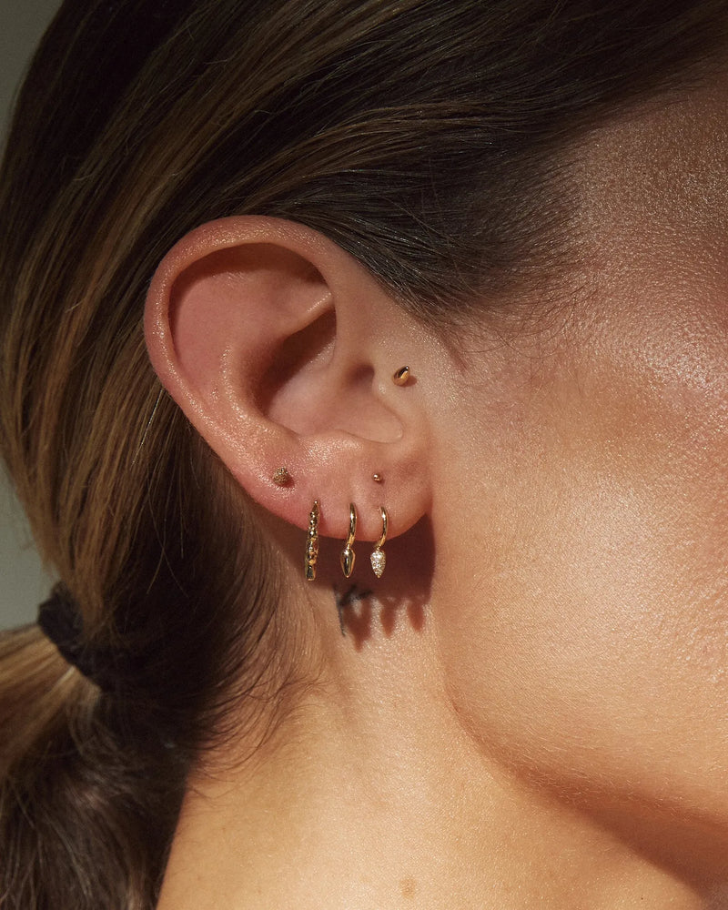 2mm Tiny Molten Stud by Pamela Love – Piercing in #product_material# (#product_color#). 