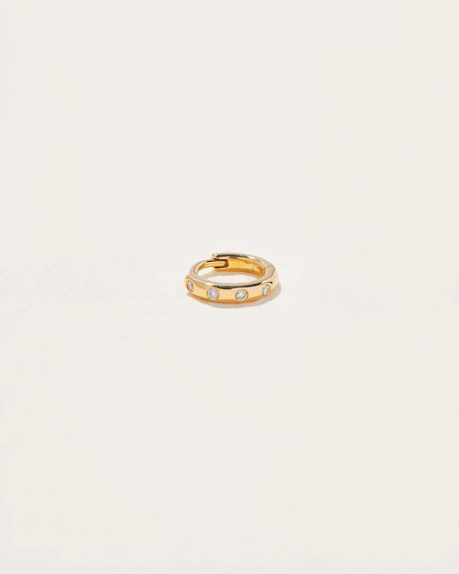 6mm Dot Huggie by Pamela Love – Piercing in #product_material# (#product_color#). 