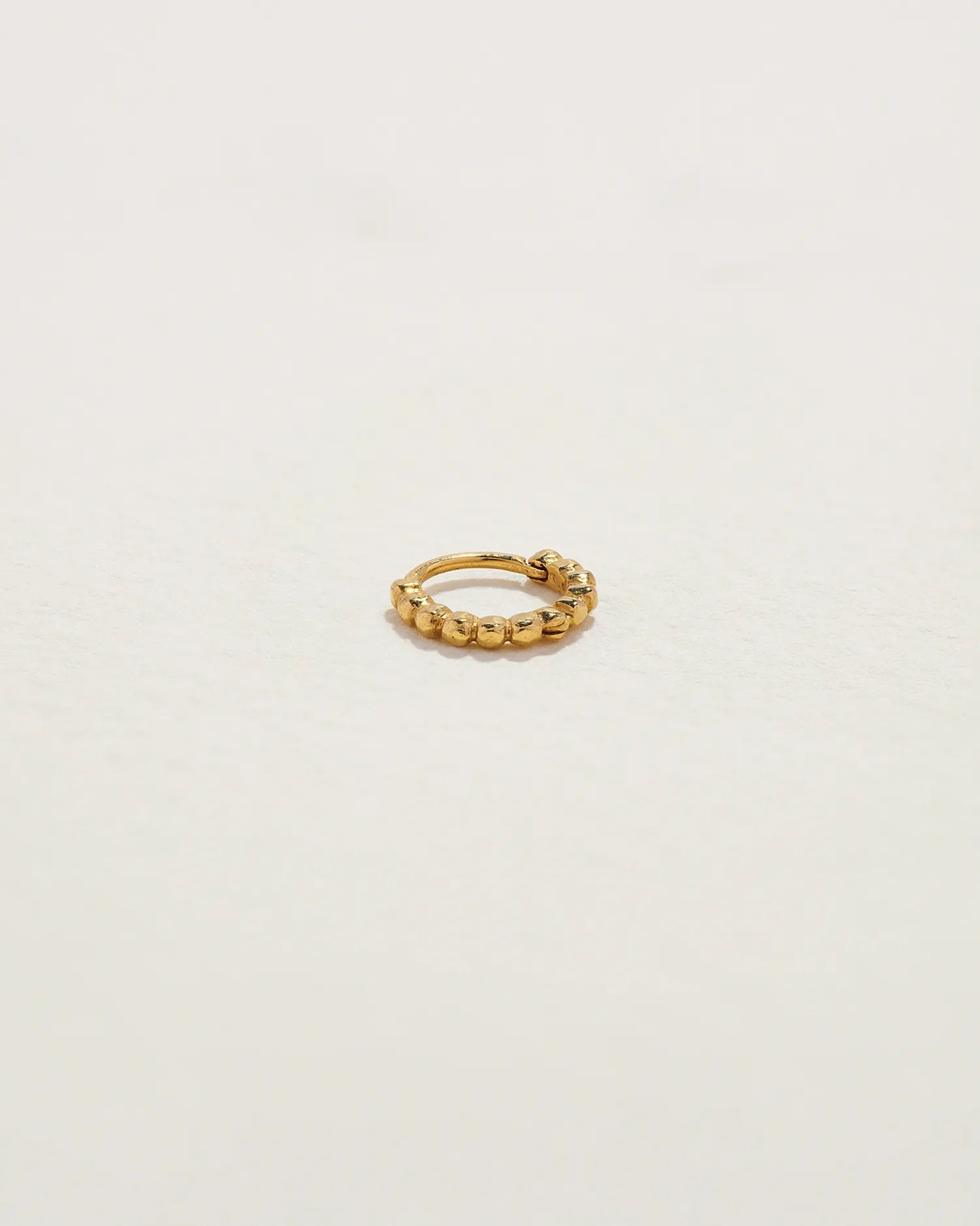 6mm Molten Eternity Huggie by Pamela Love – Piercing in #product_material# (#product_color#). 