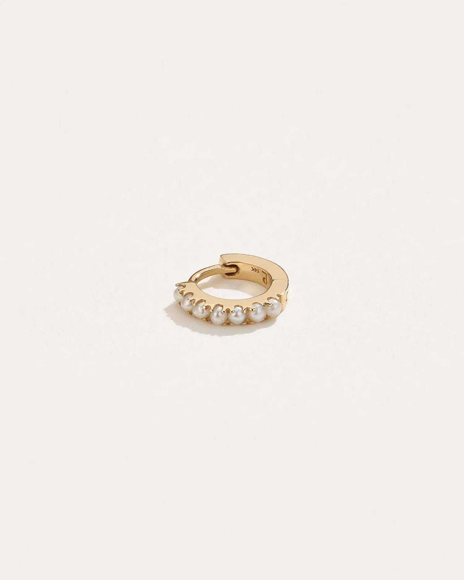6mm Pavé Huggie by Pamela Love – Piercing in #product_material# (#product_color#).  6mm-pave-huggie-gold-pearl-white