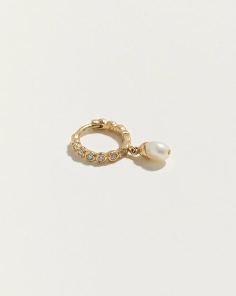 8mm Eternity Baroque Huggie by Pamela Love – Piercing in #product_material# (#product_color#). 