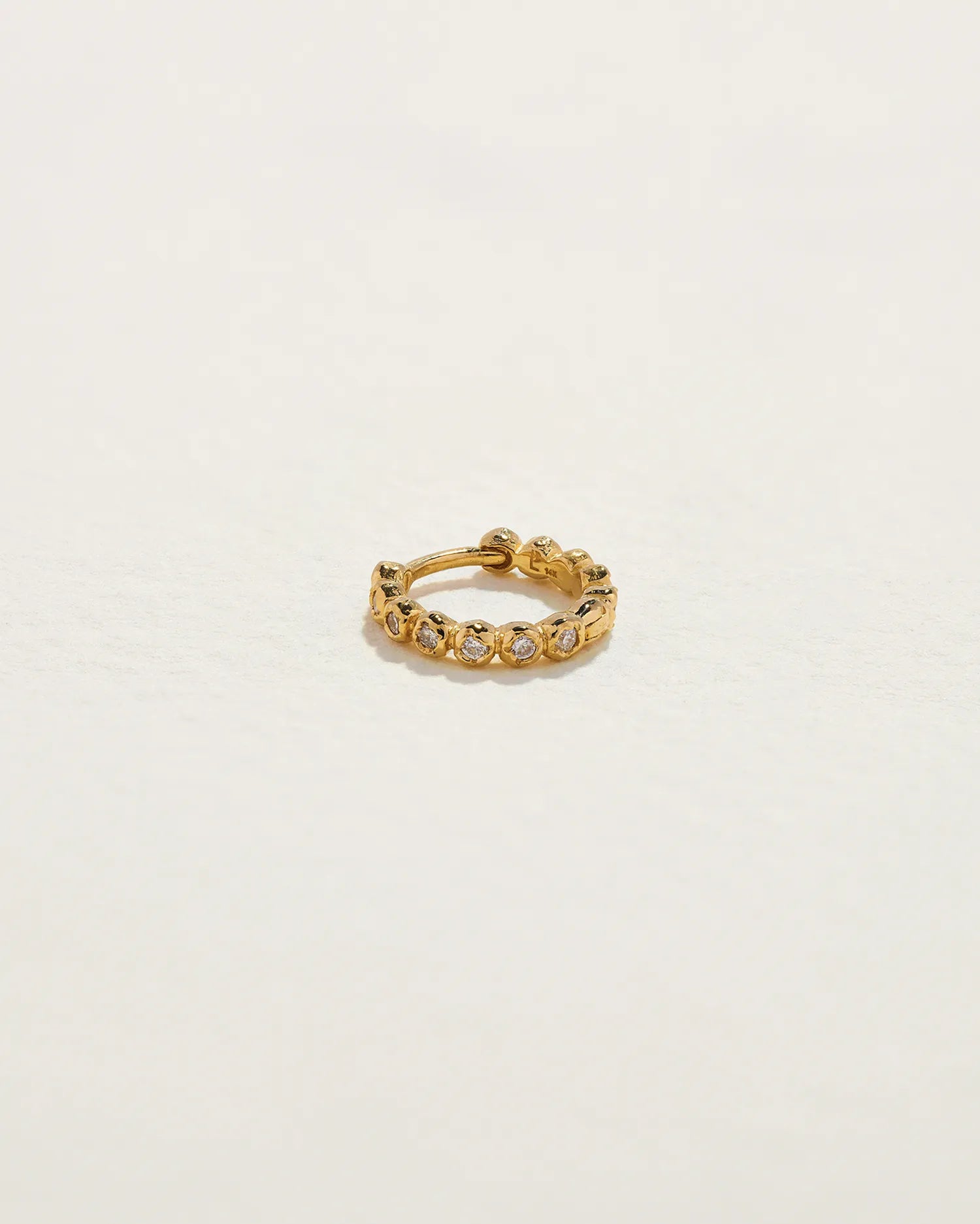 8mm Molten Eternity Huggie by Pamela Love – Piercing in #product_material# (#product_color#). 