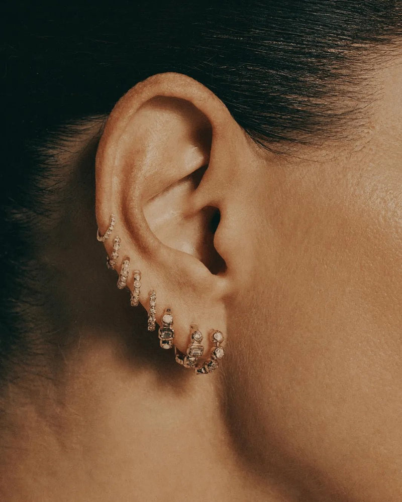 8mm Molten Pavé Huggie by Pamela Love – Piercing in #product_material# (#product_color#). 