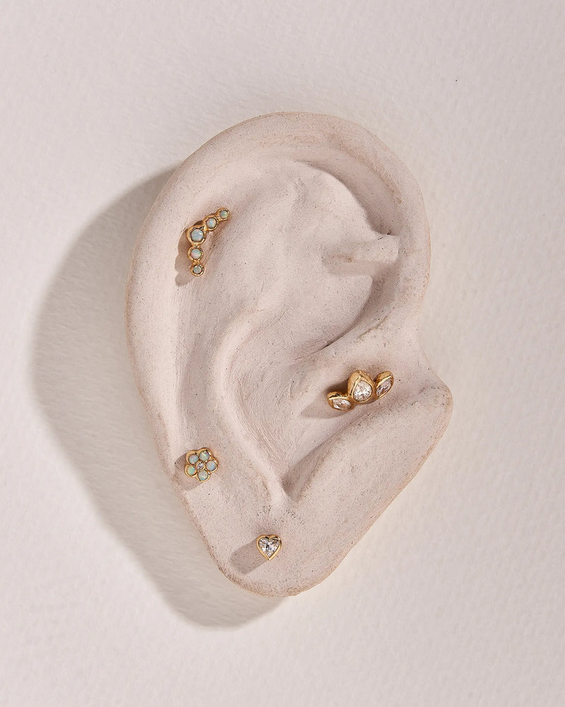Bezel Flower Stud by Pamela Love – Piercing in #product_material# (#product_color#). 