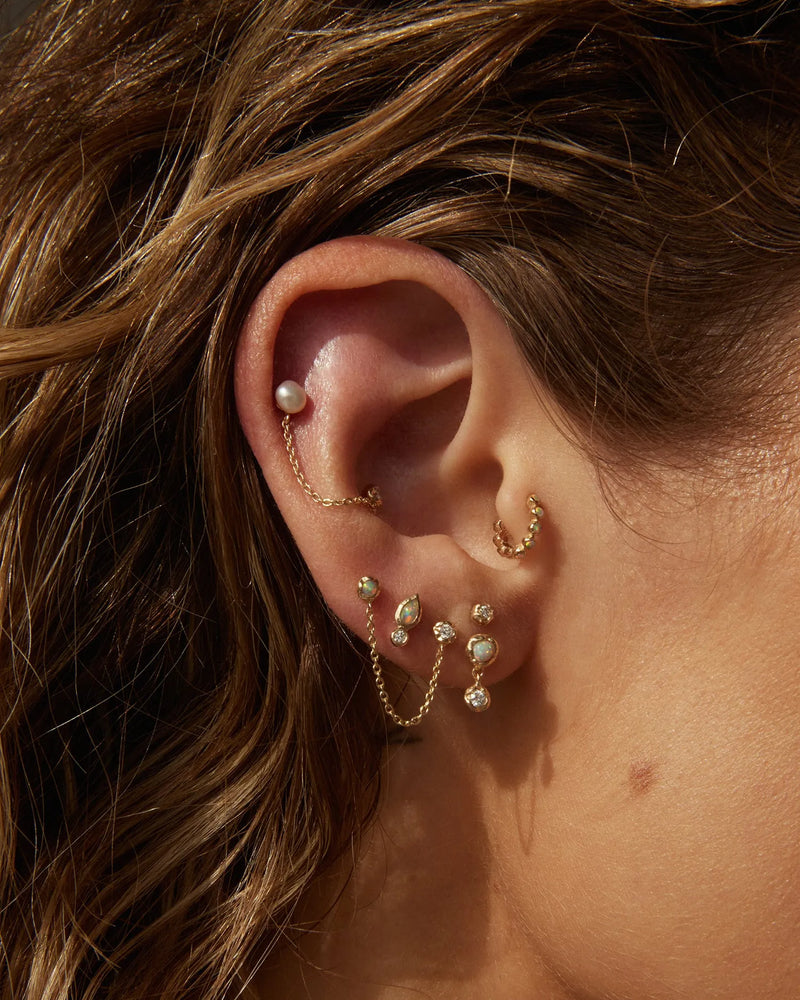 Bezel Pear Stud by Pamela Love – Piercing in #product_material# (#product_color#). 