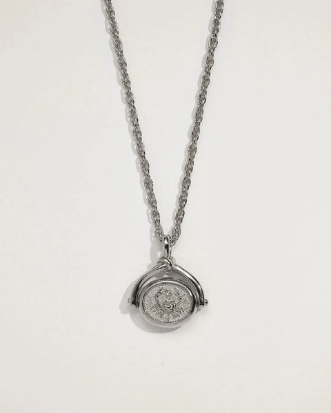 Front view of silver-plated brass Cancer spinner pendant necklace with Cancer motif on an 18-inch chain
