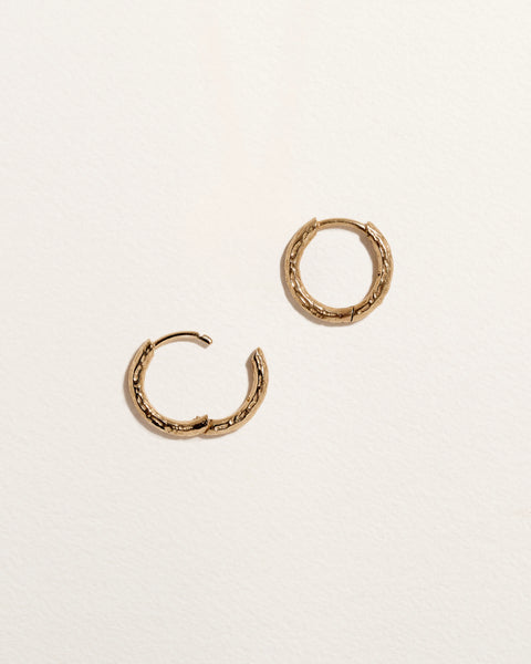 Hand Carved Huggie by Pamela Love – Piercing in #product_material# (#product_color#). 