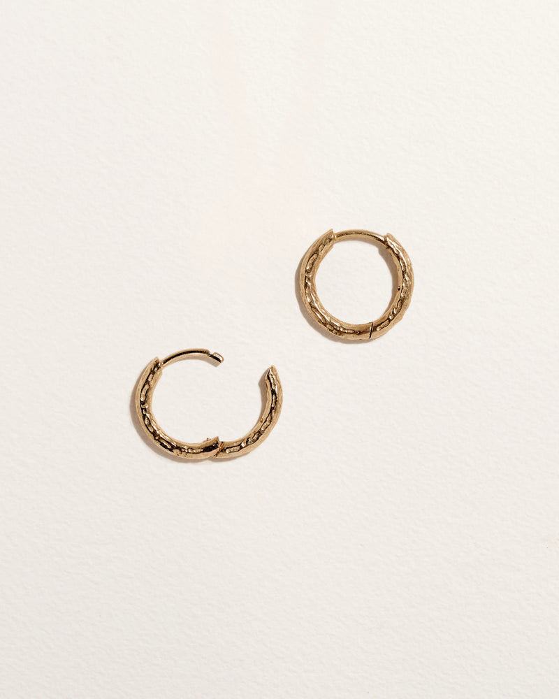 Hand Carved Huggie by Pamela Love – Piercing in #product_material# (#product_color#). 