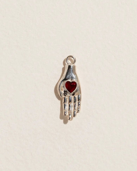 Heart in Hand Charm by Pamela Love – Charm in #product_material# (#product_color#).  heart-in-hand-charm-sterling-silver-glass-red