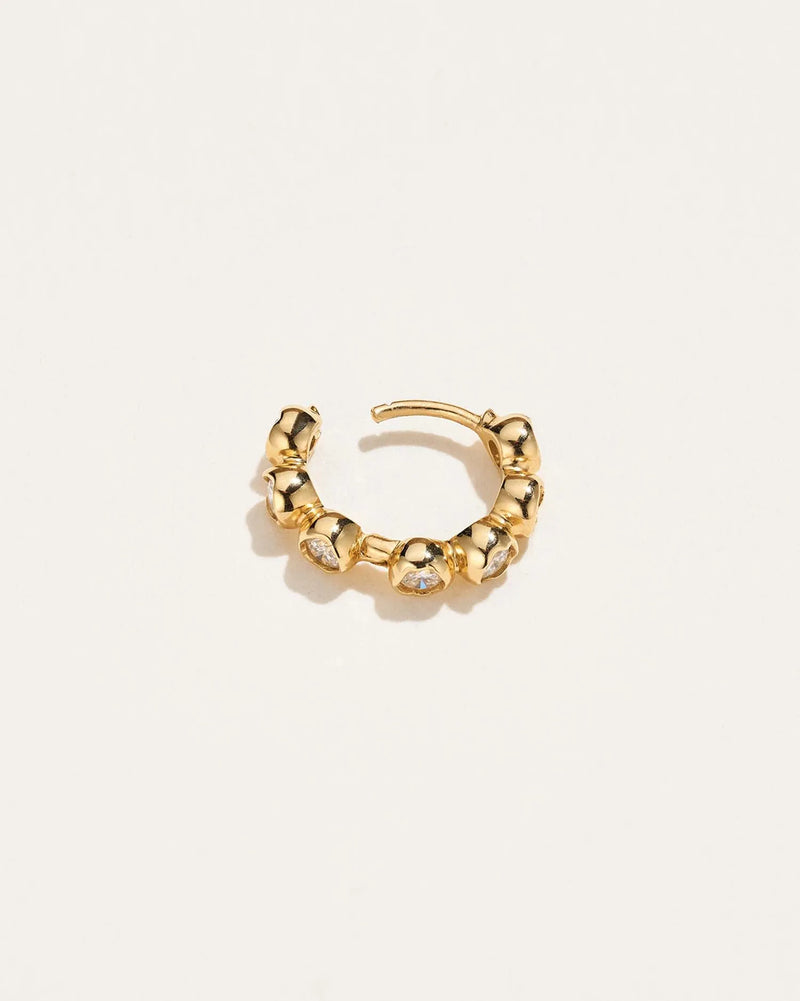 Molten Stone Huggie by Pamela Love – Piercing in #product_material# (#product_color#). 