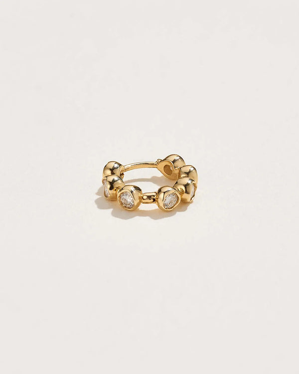 Molten Stone Huggie by Pamela Love – Piercing in #product_material# (#product_color#). 