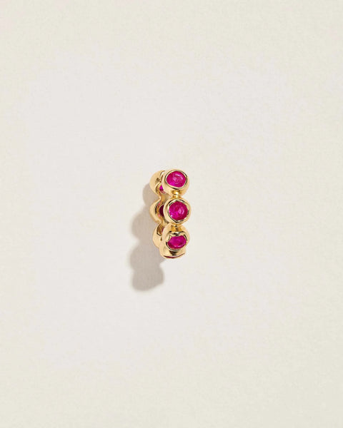 Molten Stone Huggie by Pamela Love – Piercing in #product_material# (#product_color#).  molten-stone-clicker-gold-ruby-red