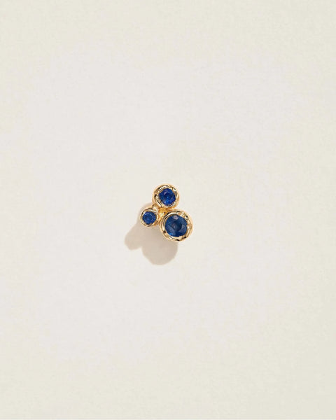 Molten Trio Stud by Pamela Love – Piercing in #product_material# (#product_color#).  molten-trio-stud-gold-sapphire-blue
