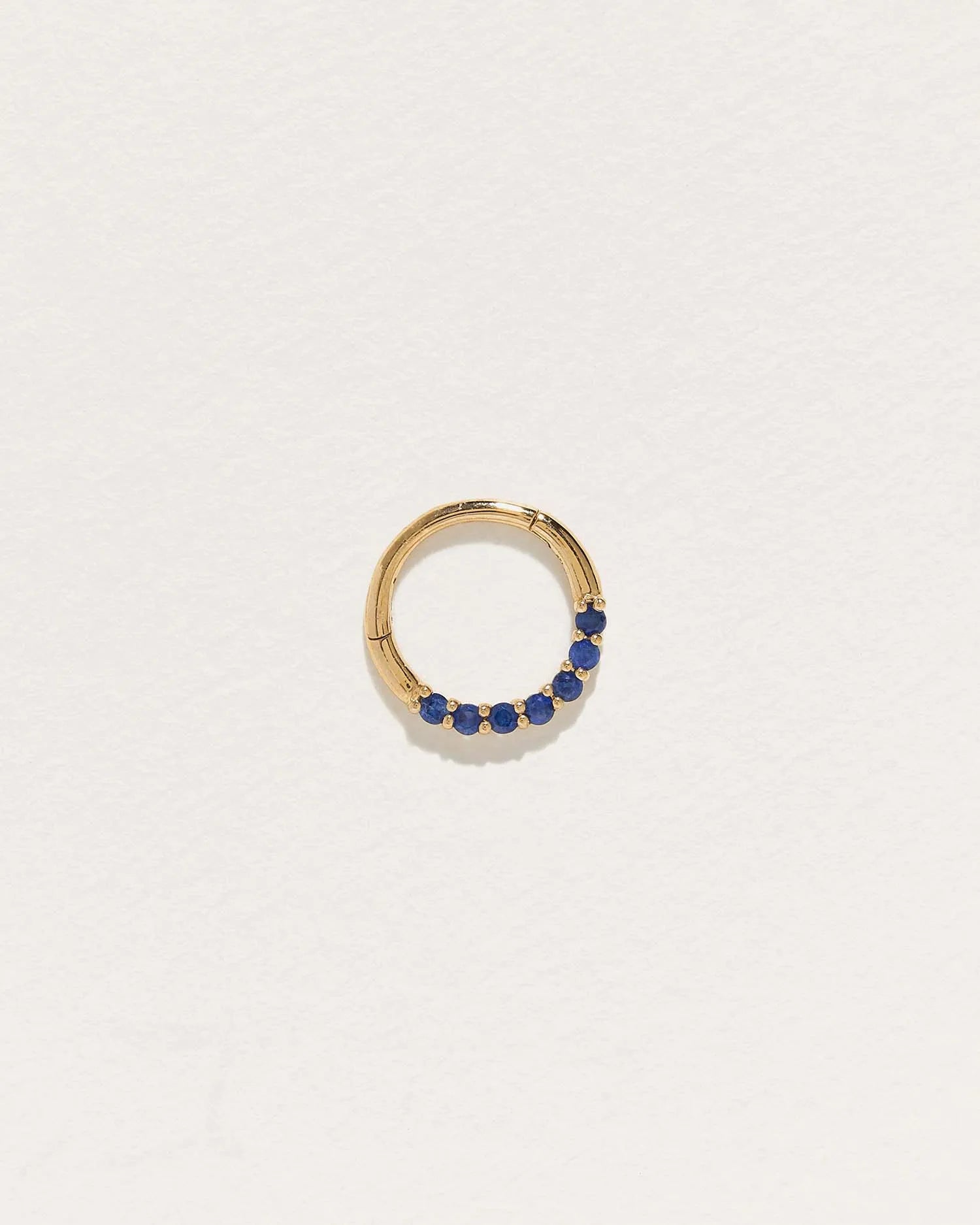 Pave Clicker by Pamela Love – Piercing in #product_material# (#product_color#).  pave-clicker-gold-sapphire-blue