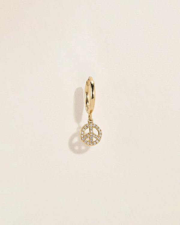Pavé Peace Huggie by Pamela Love – Piercing in #product_material# (#product_color#). 