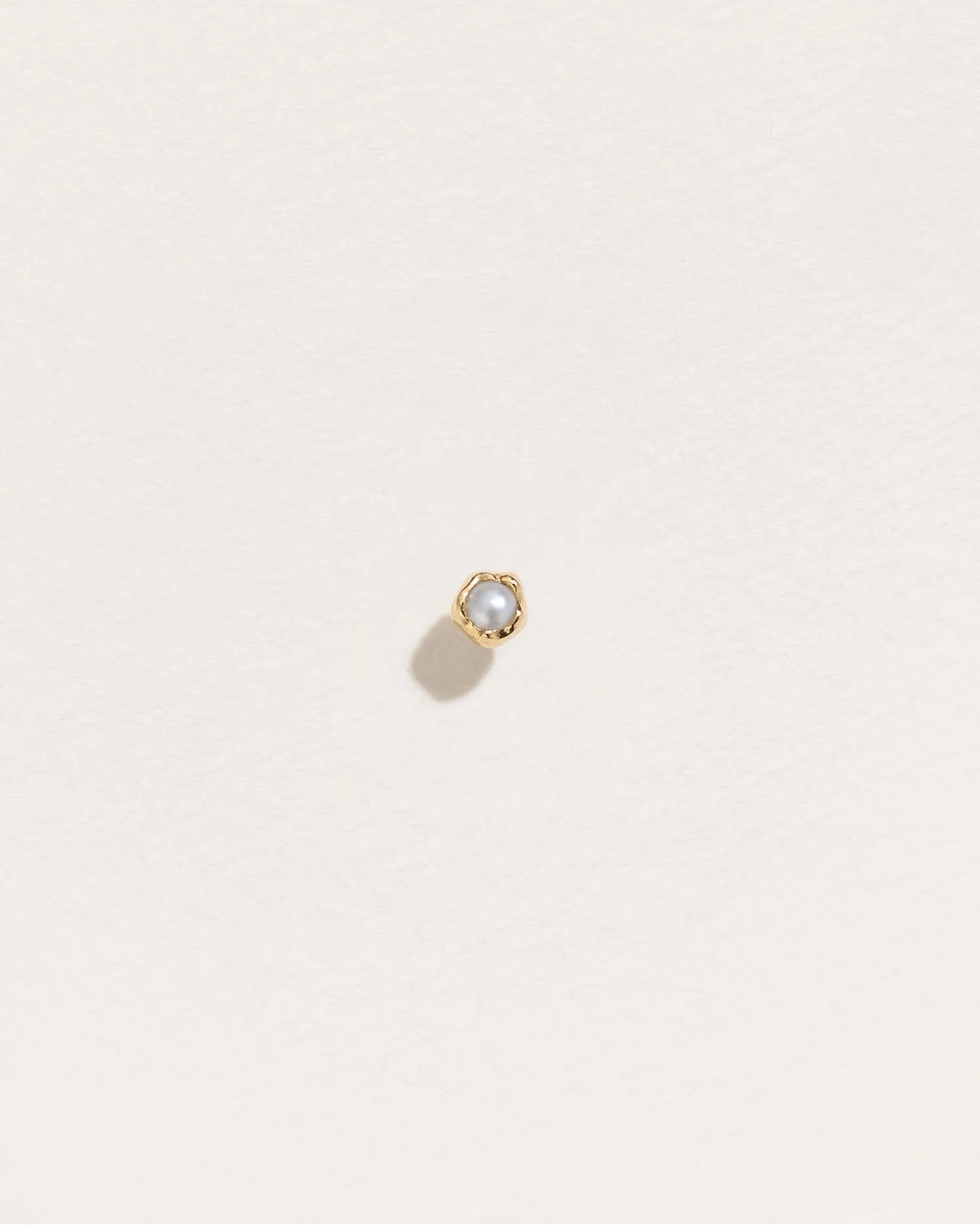 Petite Nugget Stud by Pamela Love – Piercing in #product_material# (#product_color#).  petite-nugget-stud-gold-pearl-white