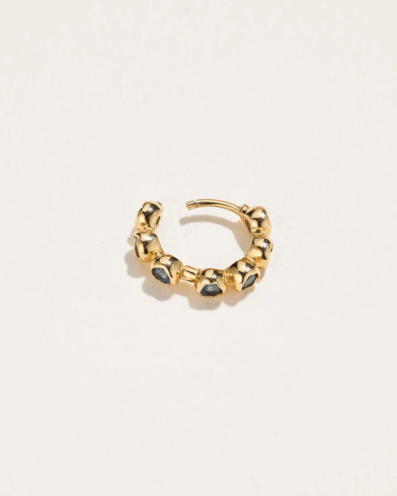 Molten Stone Huggie by Pamela Love – Piercing in #product_material# (#product_color#). 