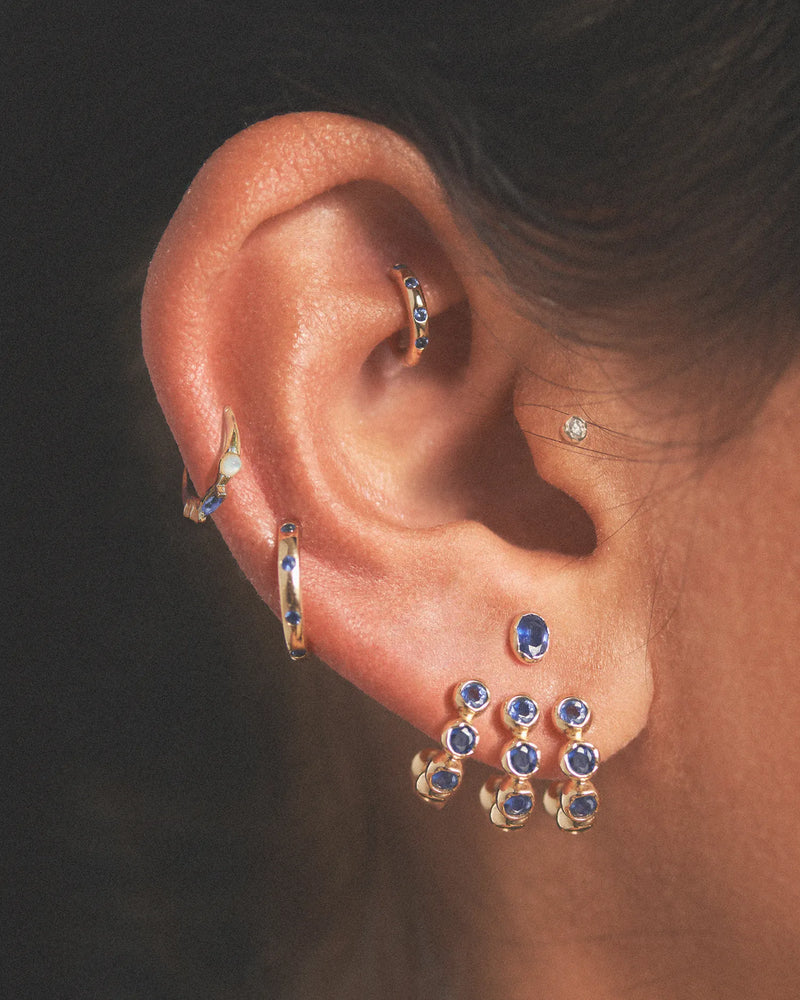 Molten Stone Huggie by Pamela Love – Piercing in #product_material# (#product_color#). 