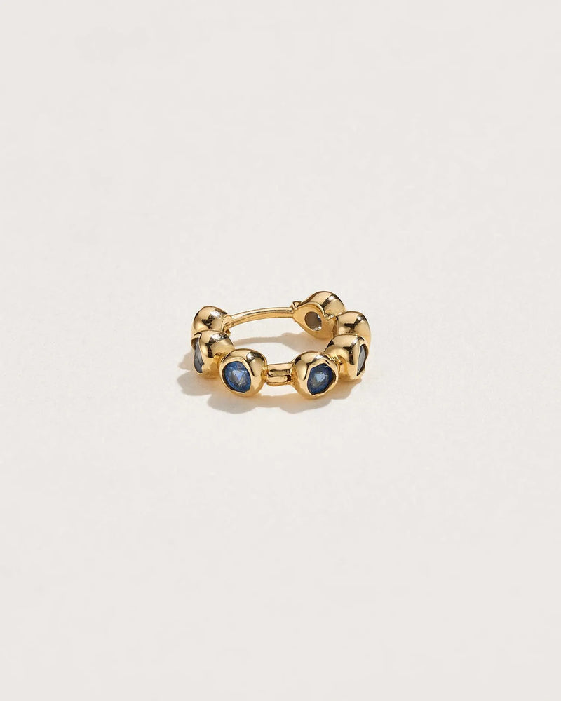 Molten Stone Huggie by Pamela Love – Piercing in #product_material# (#product_color#). 