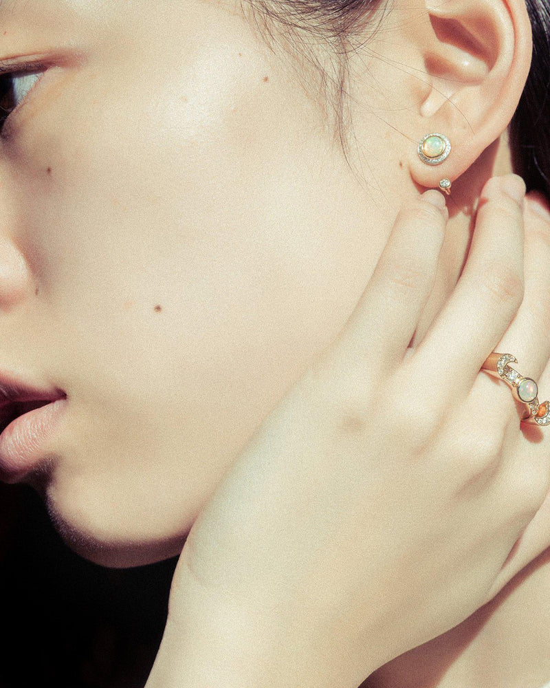 gravitation earrings on the model