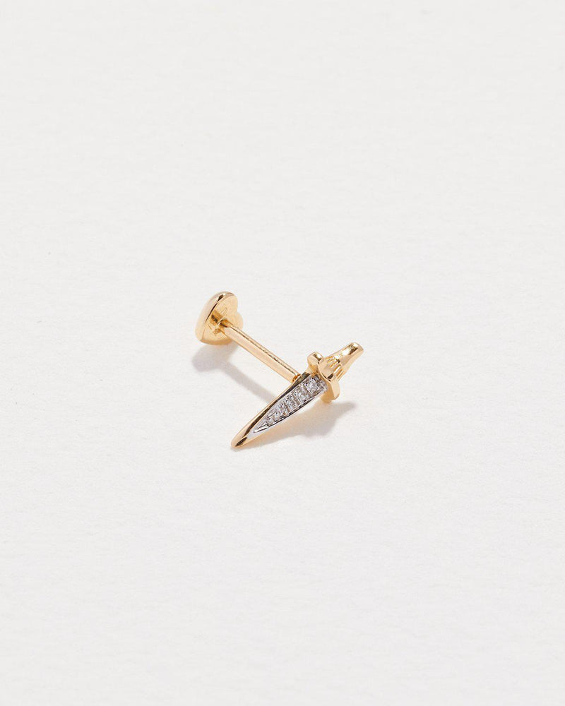 dagger stud piercing with gold and white diamonds