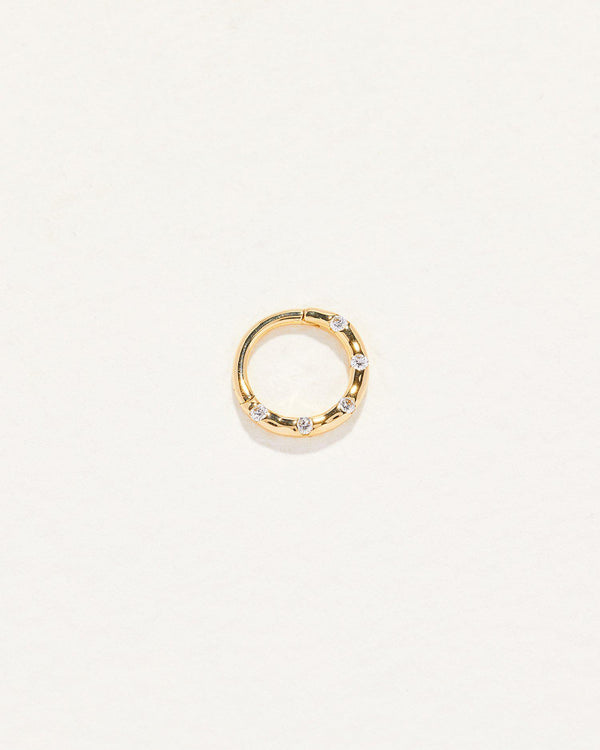 gold clicker piercing with diamond dots