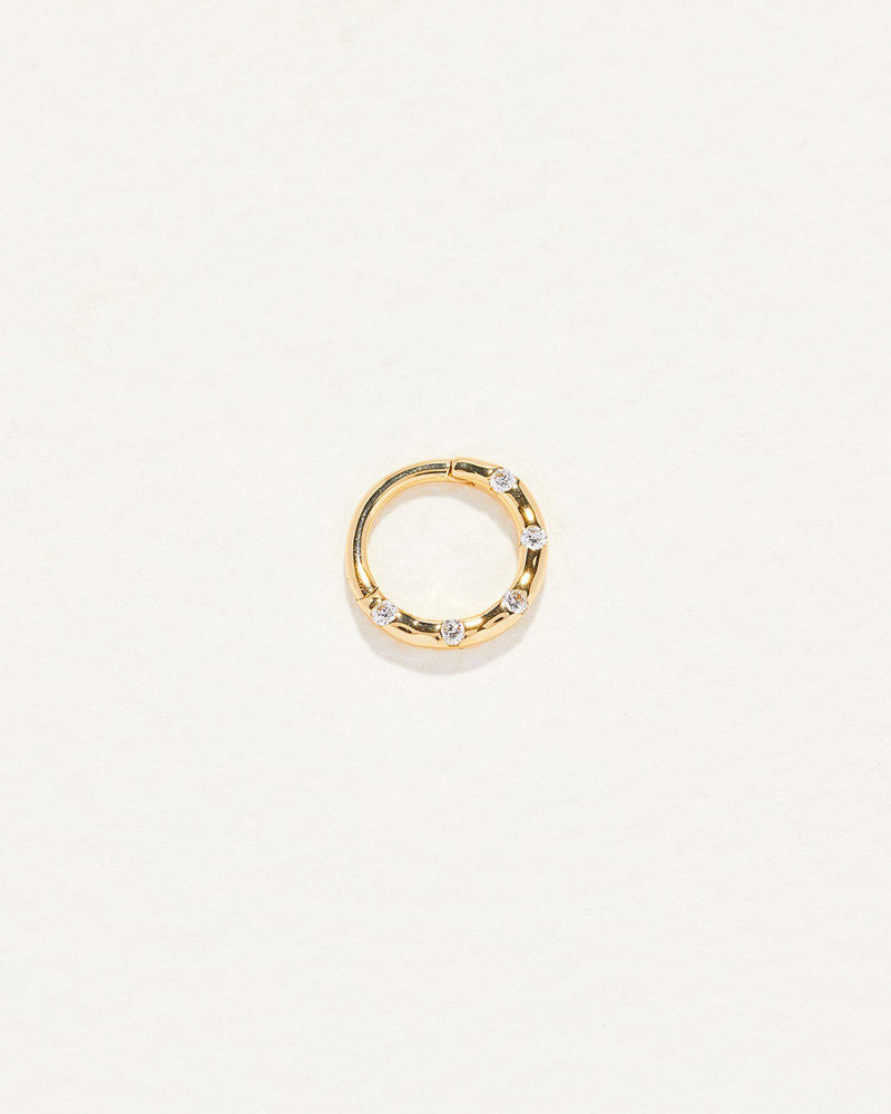 gold clicker piercing with diamond dots