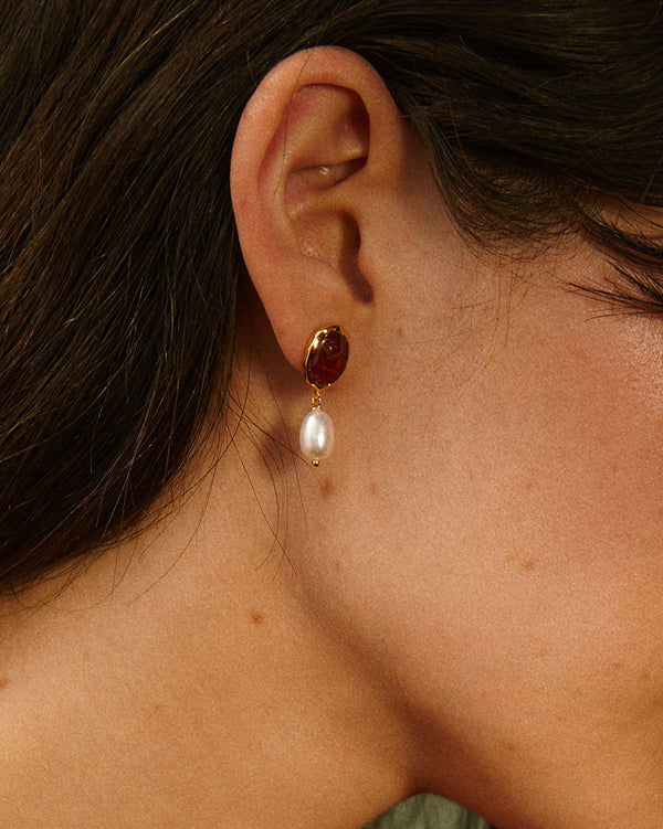 taia drop earrings on the model