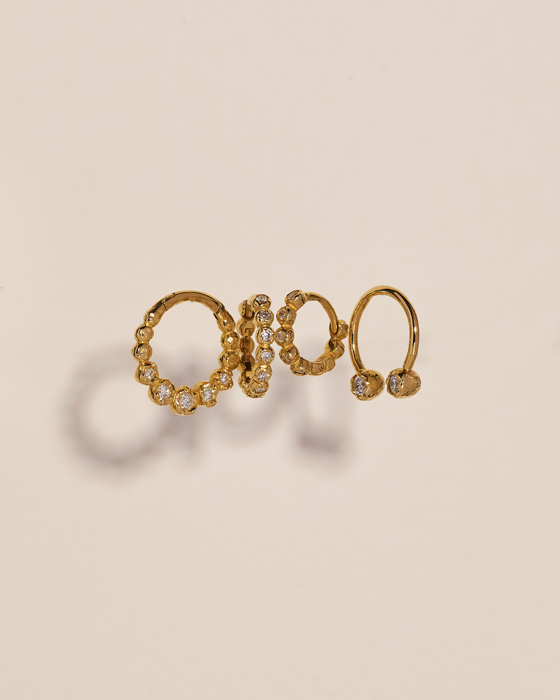 gold ear piercings with diamonds