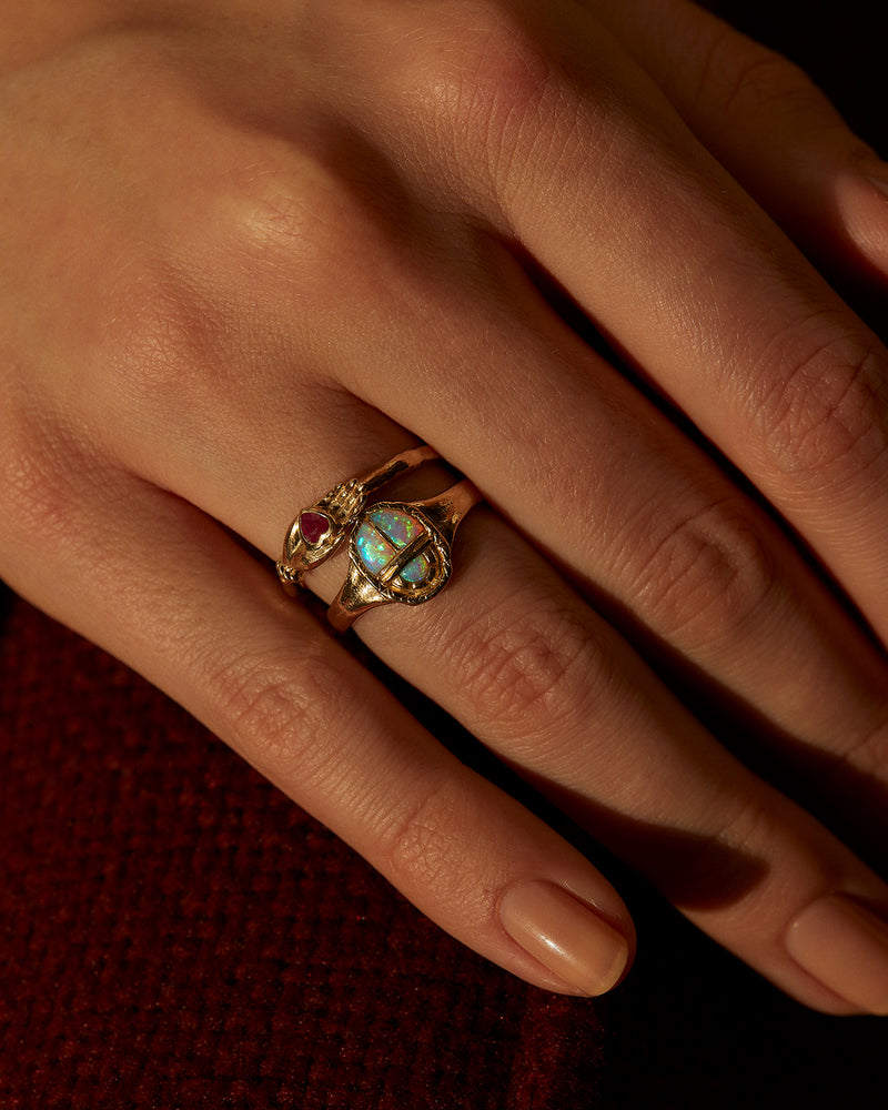 ruby heart in hand ring on the model