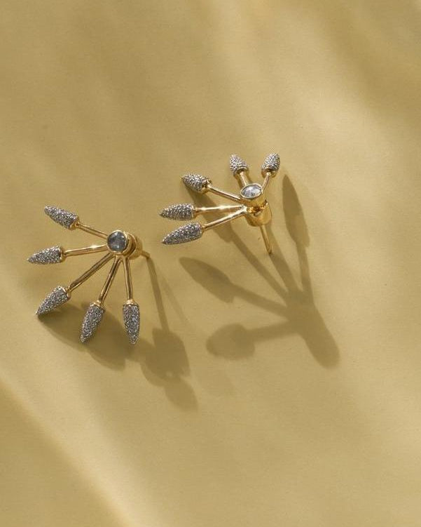 five spike earrings with diamonds