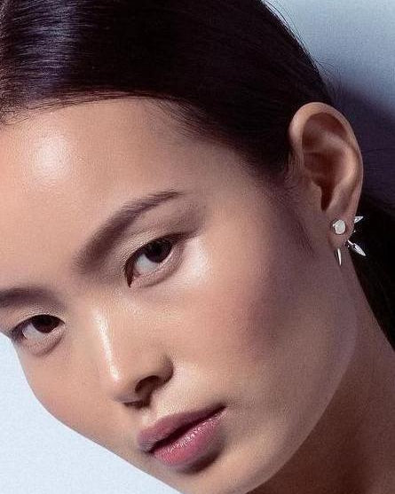 beam earrings on the model