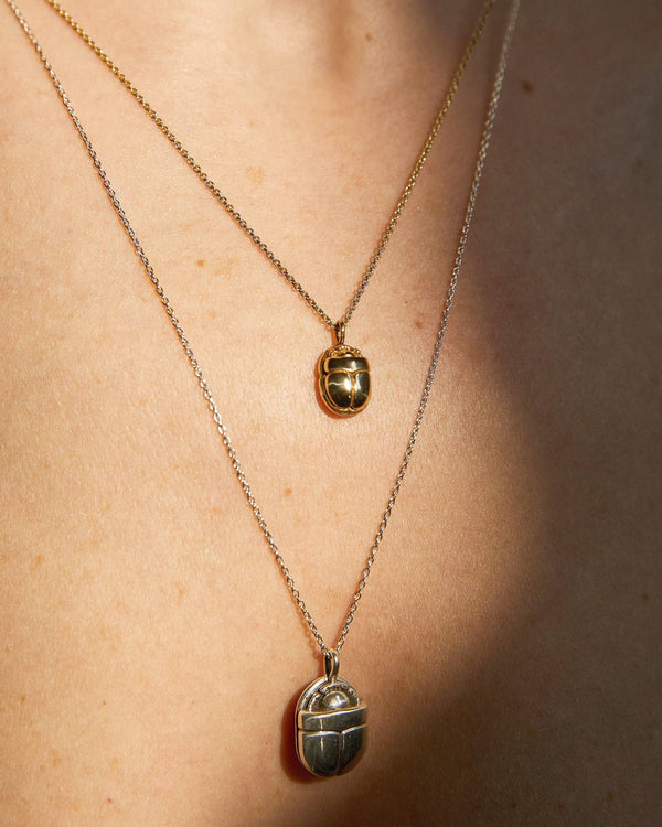 scarab necklaces on the model