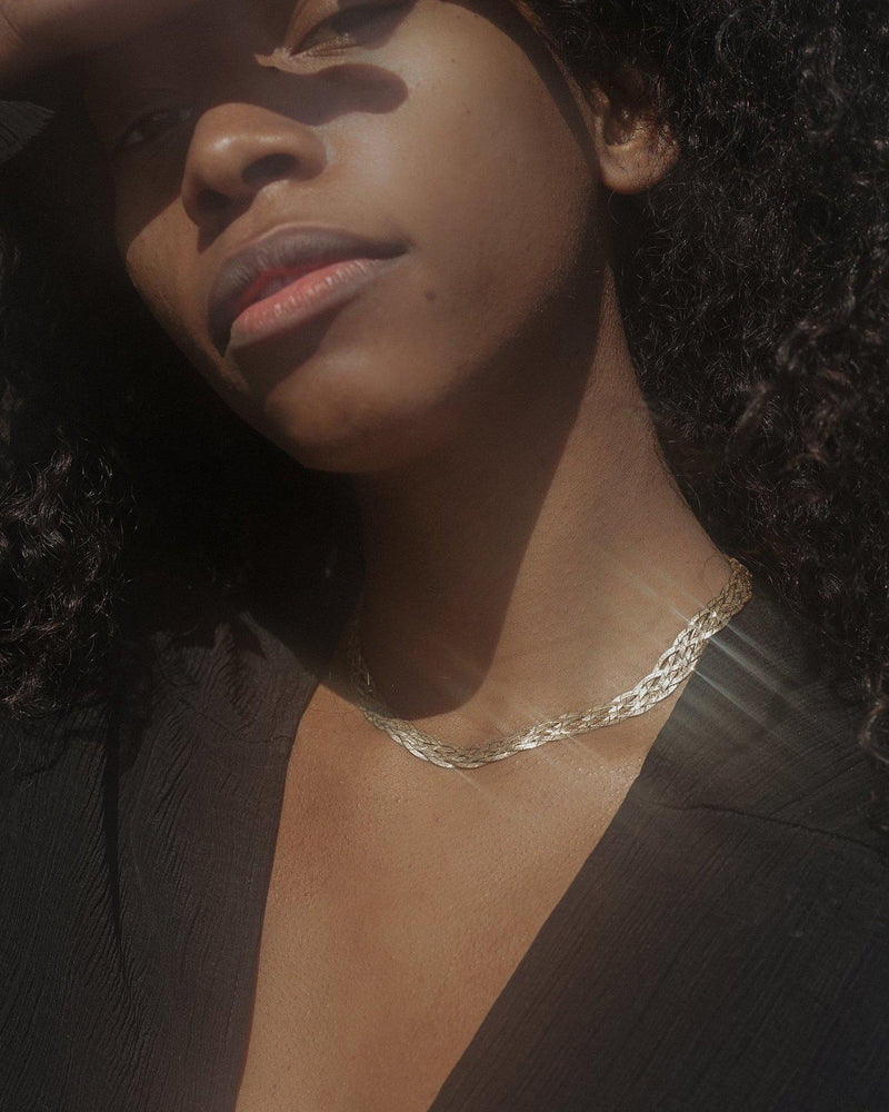 herringbone braided silver chain necklace on the model