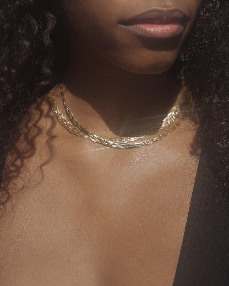 herringbone braided chain necklaces on the model