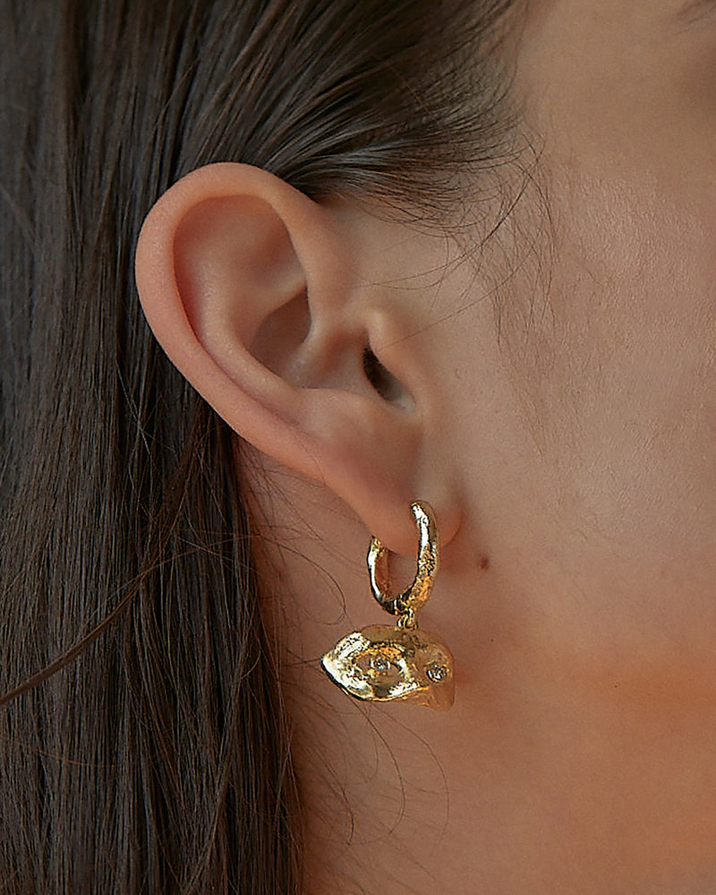 gold mask earring with diamond eyes