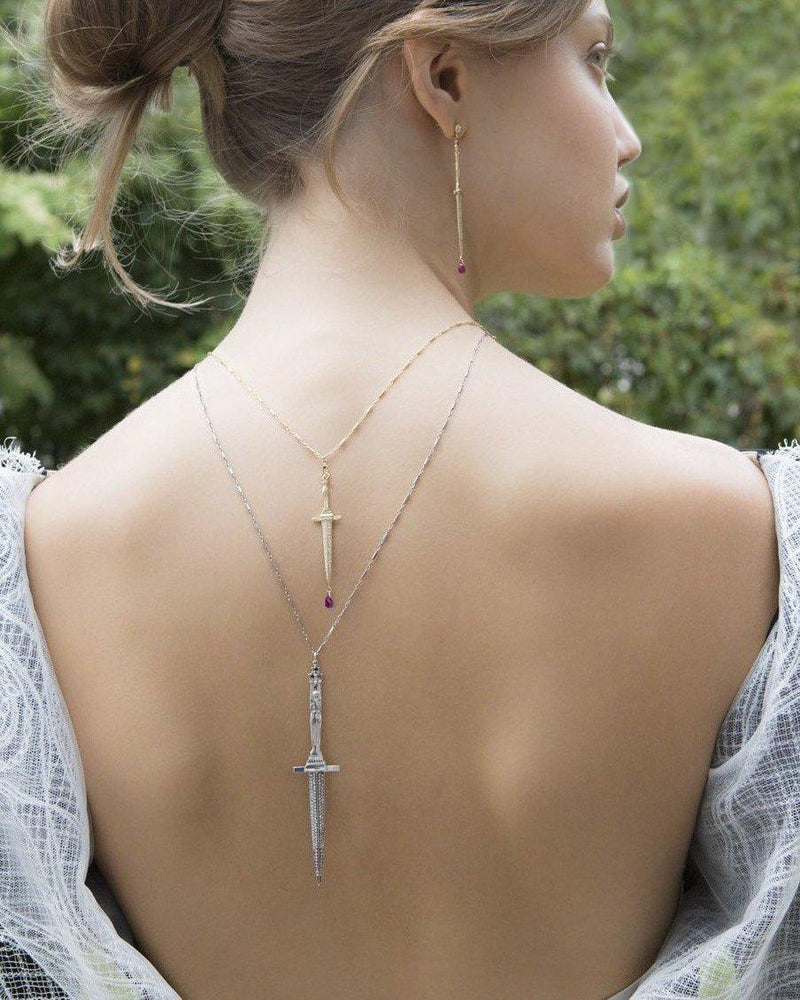 dagger necklaces on the model