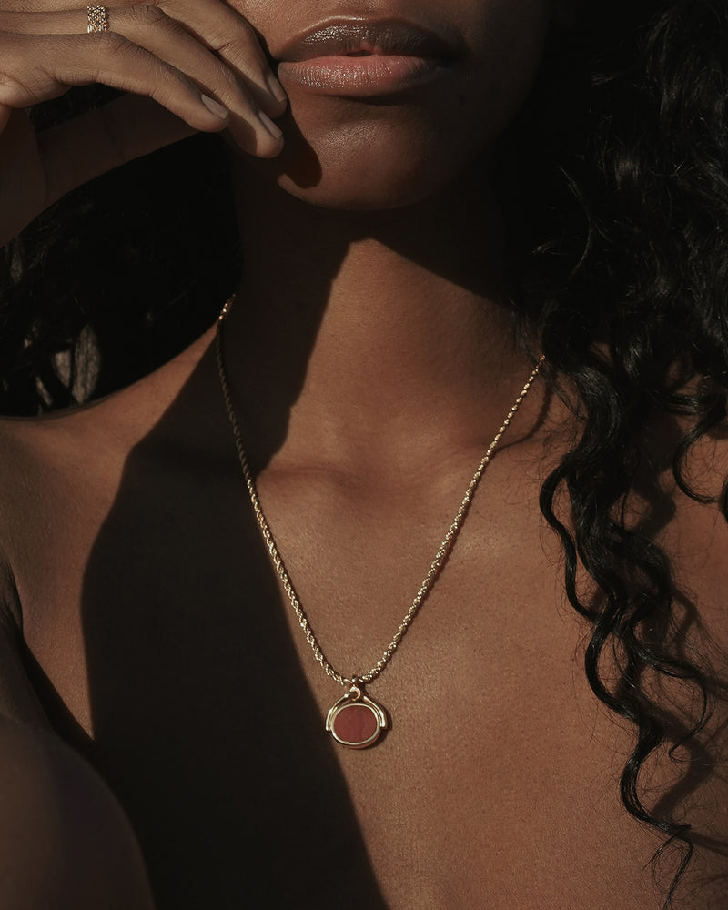 spinner pendant necklace on the model