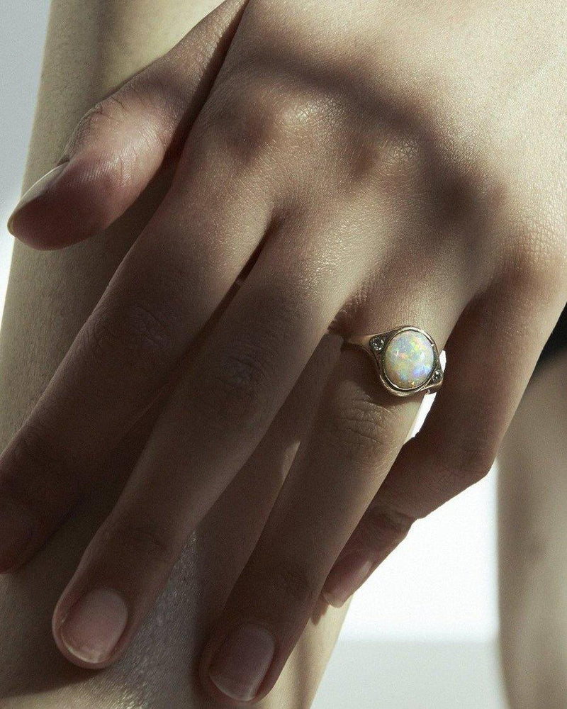 opal ring with sterling silver on the models hand