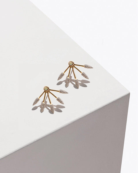 gold five spike earrings with white diamonds