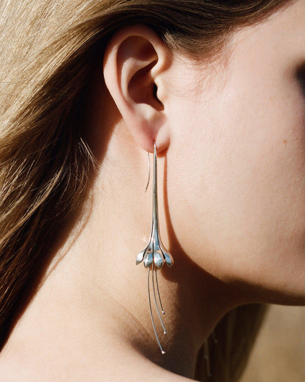 anemone flower statement earrings on the model