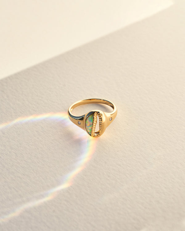 cowrie shell ring with gibson opal and diamond